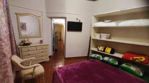 a bedroom with a bunk bed and a mirror at Casa de Abuela Petra in Gáldar