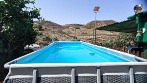 a swimming pool in the middle of a yard at Casa de Abuela Petra in Gáldar