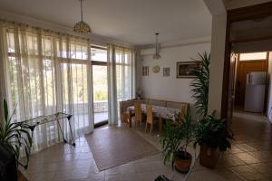 a living room with a kitchen and a dining room at Villa Sveta in Petrovac na Moru