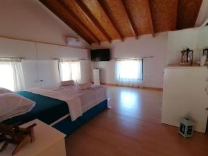 a bedroom with a large bed in a room at Villa ioli breathtaking view & sunset in Agios Nikitas +68 photos