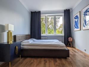 En eller flere senge i et værelse på Matisse by mythings