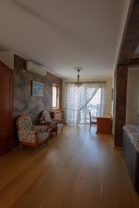 a living room with furniture and a large window at Villa Sveta in Petrovac na Moru +48 photos