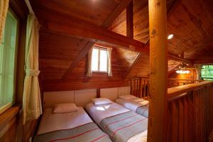 Postel nebo postele na pokoji v ubytování 月の街60号北軽井沢
