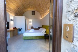 Bastione Spasimo Boutique Hotel客房内的一张或多张床位
