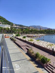 a view of a beach with people in the water at Alchemilla Holiday Home in Salerno