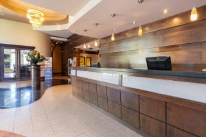 a lobby with a bar in a hotel at Sandman Suites Surrey - Guildford in Surrey
