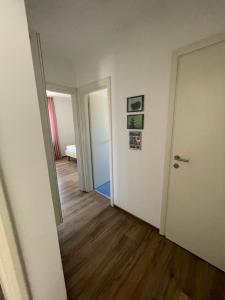 an empty room with a hallway with a door at Family apartment B&B in Biograd na Moru