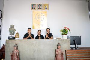 a group of people standing behind a counter at Grange in Siem Reap