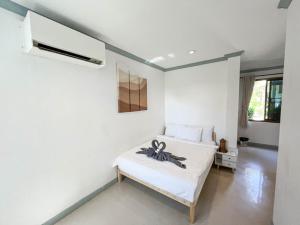Postel nebo postele na pokoji v ubytování TropiCoco Beach Resort Koh Phangan