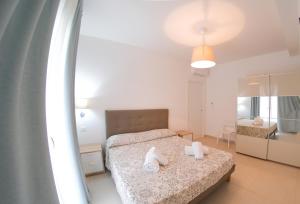 Posteľ alebo postele v izbe v ubytovaní Residence Chanel