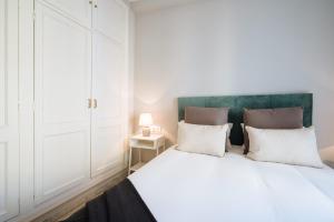 Łóżko lub łóżka w pokoju w obiekcie Guadalquivir Terrace Suite Apartments