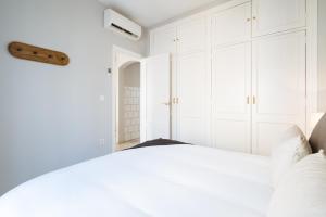 Łóżko lub łóżka w pokoju w obiekcie Guadalquivir Terrace Suite Apartments