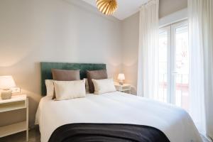 Łóżko lub łóżka w pokoju w obiekcie Guadalquivir Terrace Suite Apartments