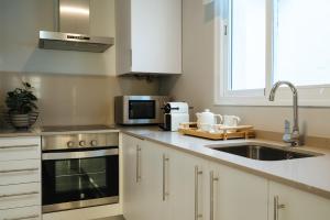 Kuchnia lub aneks kuchenny w obiekcie Guadalquivir Terrace Suite Apartments