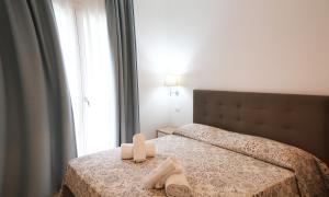 Posteľ alebo postele v izbe v ubytovaní Residence Chanel