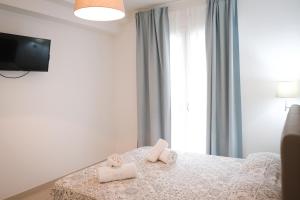 Posteľ alebo postele v izbe v ubytovaní Residence Chanel