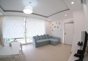 Televízia a/alebo spoločenská miestnosť v ubytovaní Residence Chanel