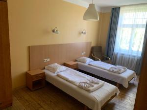 Postel nebo postele na pokoji v ubytování Guesthouse Jakob Lenz