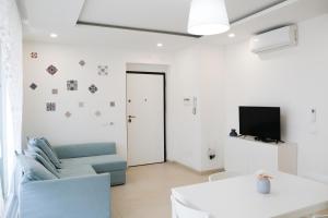 Televízia a/alebo spoločenská miestnosť v ubytovaní Residence Chanel