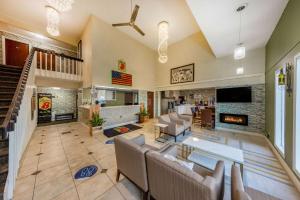 a living room with a couch and a fireplace at Super 8 by Wyndham El Dorado in El Dorado