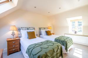 En eller flere senge i et værelse på Rambling Rose