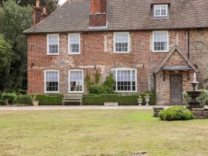 a brick house with a bench in front of it at Solton Manor in Dover