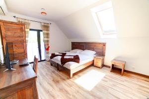 Posteľ alebo postele v izbe v ubytovaní Solny - Resort w Bieszczadach