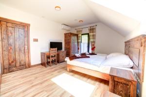 Posteľ alebo postele v izbe v ubytovaní Solny - Resort w Bieszczadach