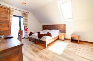 Posteľ alebo postele v izbe v ubytovaní Solny - Resort w Bieszczadach