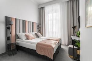 Posteľ alebo postele v izbe v ubytovaní Old Town Residence Aparthotel