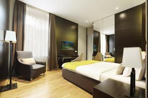 Postel nebo postele na pokoji v ubytování Maccani Black Luxury Suites
