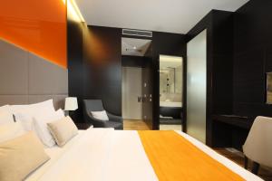 Postel nebo postele na pokoji v ubytování Maccani Black Luxury Suites