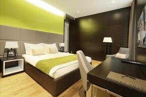 Postel nebo postele na pokoji v ubytování Maccani Black Luxury Suites