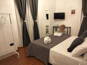 Postel nebo postele na pokoji v ubytování Frizzo House