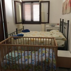 a bedroom with two bunk beds in a room at B&B Su Neulagi in Triei
