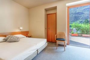 Letto o letti in una camera di Albergo Sorriso