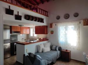 a kitchen with a couch in a small room at ''Koukmos beach'' Greenspace Living - Private sandy beach in Parákoila