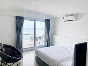 Postel nebo postele na pokoji v ubytování Pi3 Beach Resort