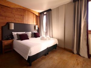 Postel nebo postele na pokoji v ubytování Chaberton Lodge & Spa