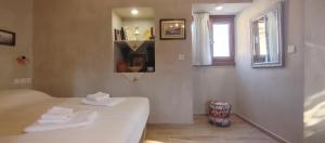 Posteľ alebo postele v izbe v ubytovaní Stavlos Country House