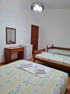Postel nebo postele na pokoji v ubytování Castello Apartments
