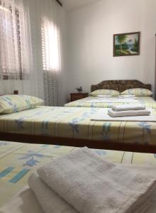 Postel nebo postele na pokoji v ubytování Castello Apartments
