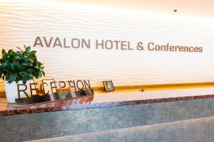 a sign that reads aviation hotel and conferences on a wall at Avalon Hotel & Conferences in Riga