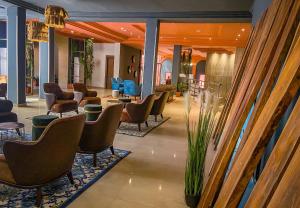 a lobby with chairs and a waiting room at HOTEL MASSALEY in Bamako