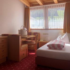Łóżko lub łóżka w pokoju w obiekcie Hotel Rosslaufhof