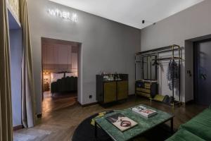 a living room with a couch and a table at Chapter Roma in Rome