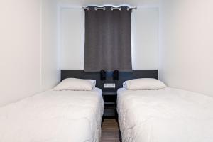 Posteľ alebo postele v izbe v ubytovaní Chalet pour 6 dans une résidence avec piscine