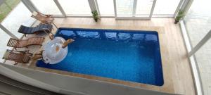 an overhead view of a swimming pool in a building at Villa Nikšić in Otočac