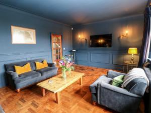 a living room with two couches and a coffee table at Warley Lodge in Halifax