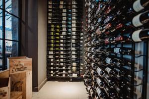 a wall of wine bottles in a wine cellar at The Bonnie Badger in Gullane